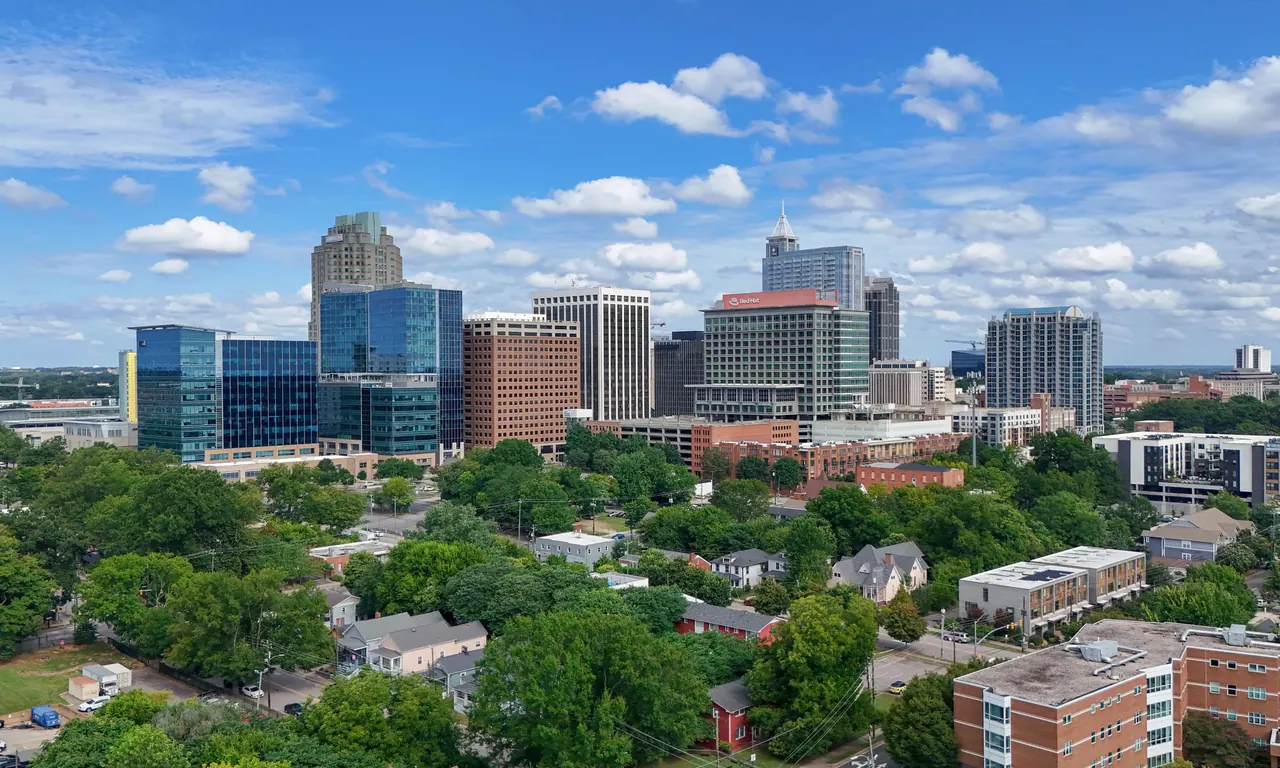 The downtown Raleigh, North Carolina skyline seen above the surrounding tree canopy