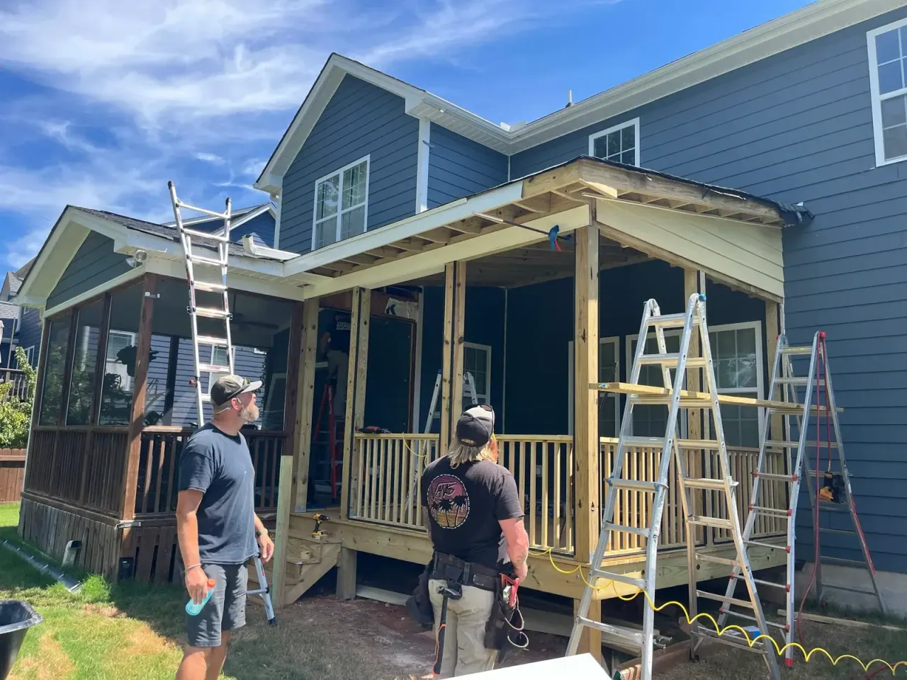 Mission Decks crew working on a screened porch build